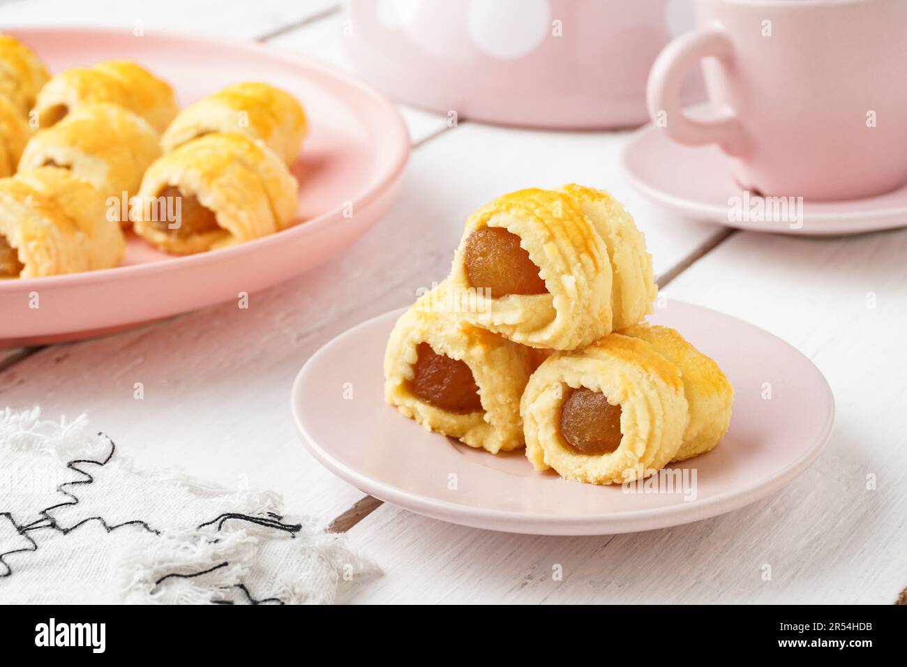 Pineapple Tart Roll cookies or Malay named Tart Nanas Gulung on white background Stock Photo