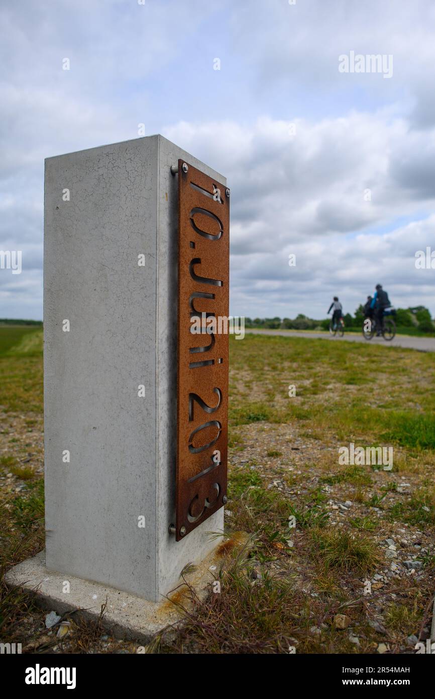 Wust Fischbeck, Germany. 18th May, 2023. '10 June 2013' can be read on a memorial stone on the dike near Fischbeck. On June 10, 2013, the June flood breached the dike near Fischbeck and flooded more than 150 square kilometers, affecting Brandenburg as well. (to dpa 'It's over' and yet not quite - Ten years of flooding') Credit: Klaus-Dietmar Gabbert/dpa/Alamy Live News Stock Photo