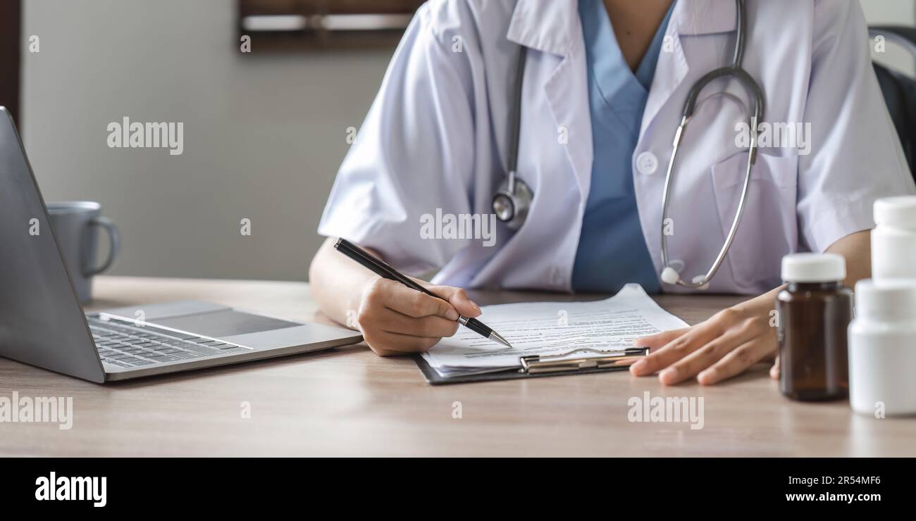 Doctor are recommending medicines to patients after being examined and ...