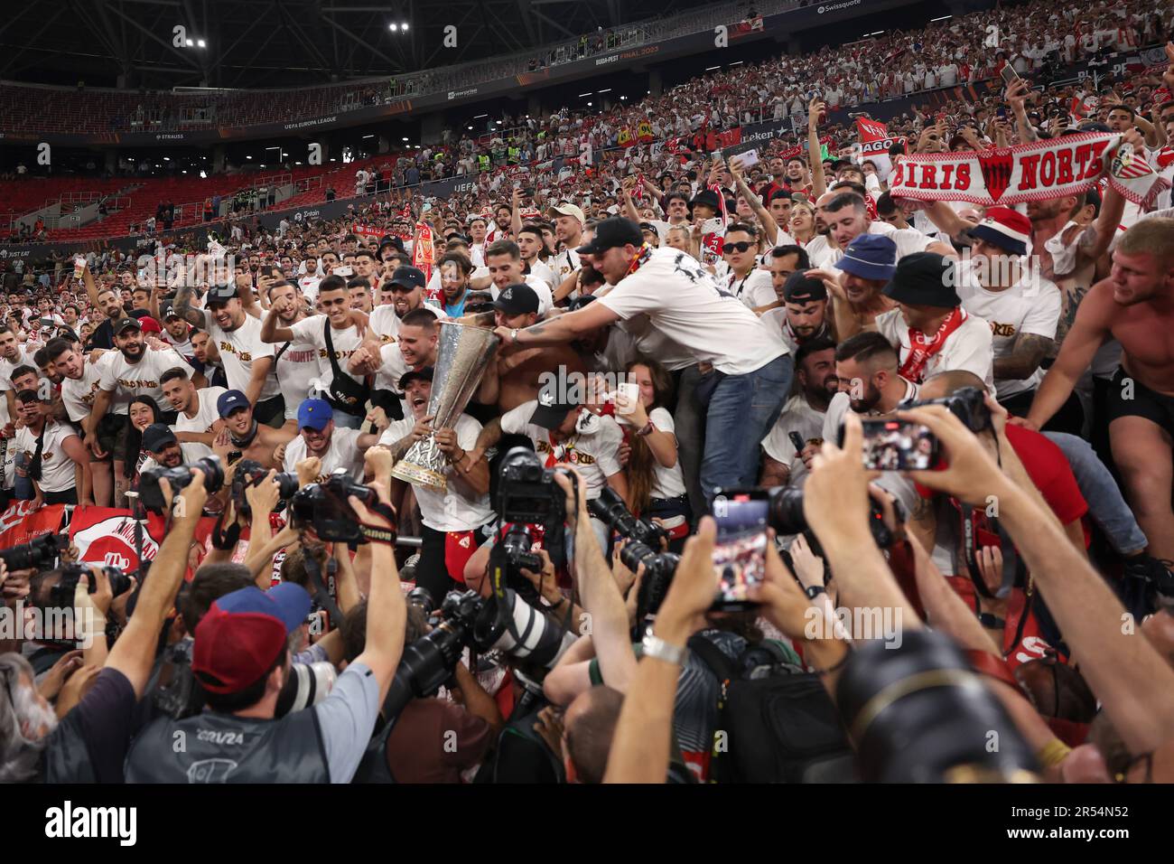 Budapest, Hungary. 31st May, 2023. Sevilla FC fans celebrate with the trophy following the penalty shoot out victory in the UEFA Europa League match at Puskas Arena, Budapest. Picture credit should read: Jonathan Moscrop/Sportimage Credit: Sportimage Ltd/Alamy Live News Stock Photo