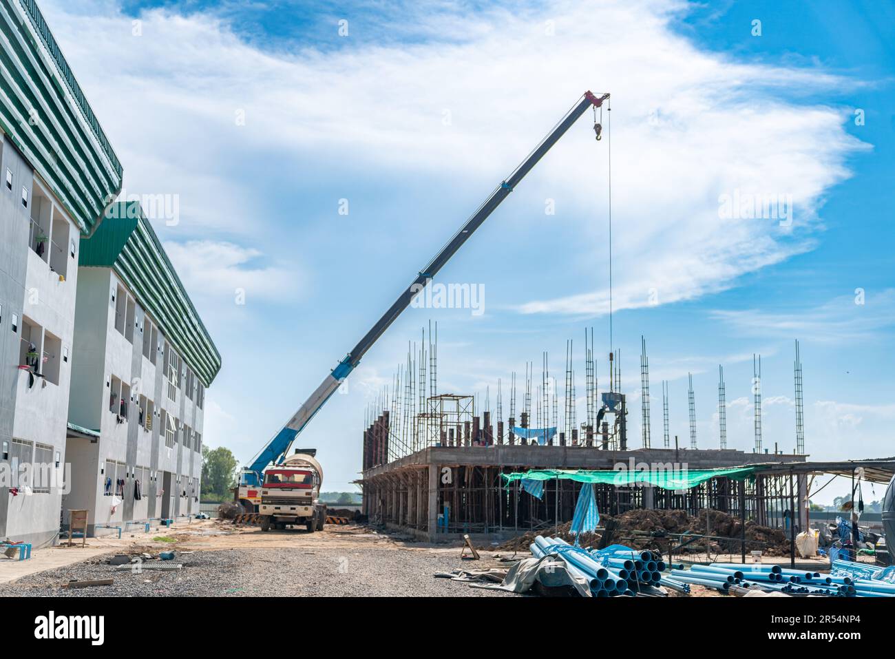 Concrete truck load concrete to bucket and mobile crain liftting pour