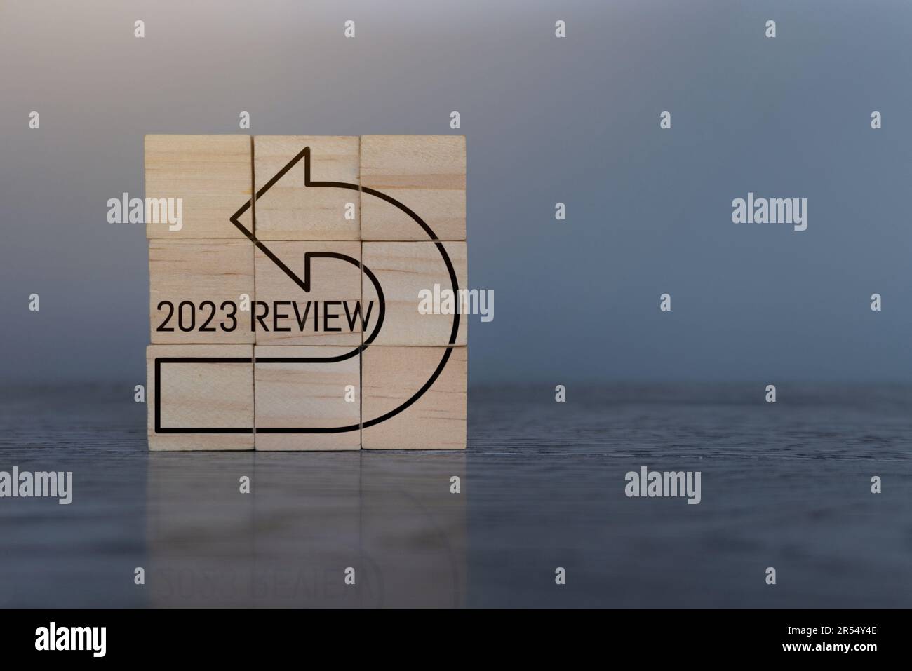 Wooden cubes with text 2023 REVIEW. Copy space for text. Annual review, evaluation and audit concept Stock Photo