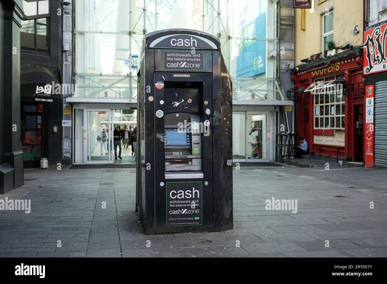 Former phone box now an ATM in Liverpool Stock Photo