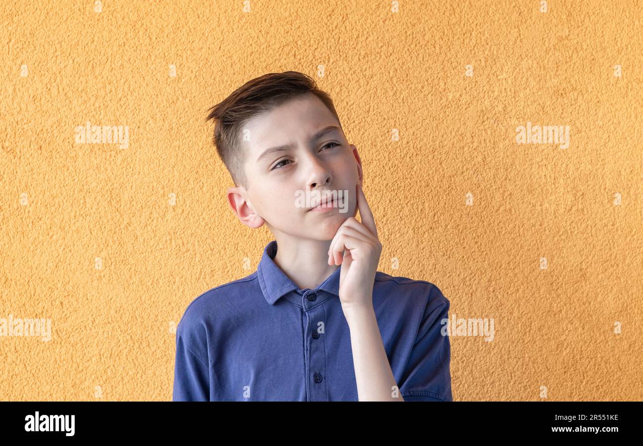 An emotional portrait of a teenage boy A brooding teenager isolated on An emotional portrait of a teenage boy A brooding teenager isolated on