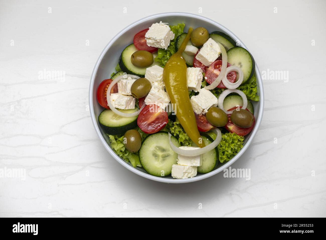 Greek Salad On White Marble Stock Photo