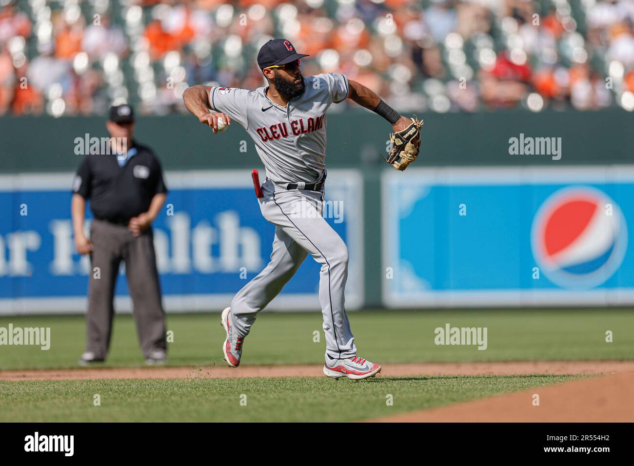 Baltimore, MD, USA; Cleveland Guardians shortstop Amed Rosario (1) fields and throws to first for the out during an MLB game against the Baltimore Ori Stock Photo