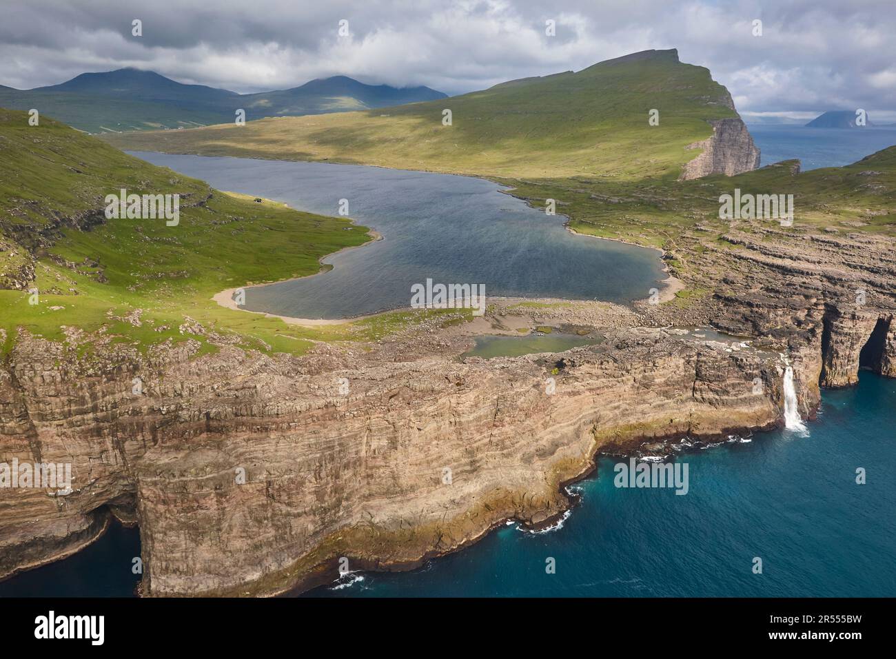 Faroe islands dramatic coastline in Vagar from helicopter. Leitisvatn ...