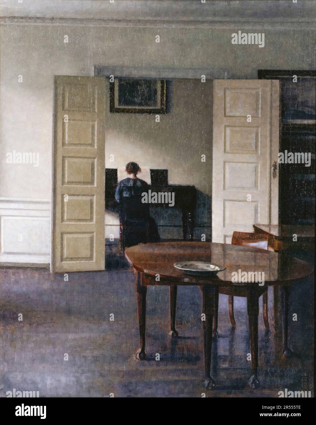 Vilhelm Hammershoi, Interior with Ida Playing the Piano, painting 1910 Stock Photo