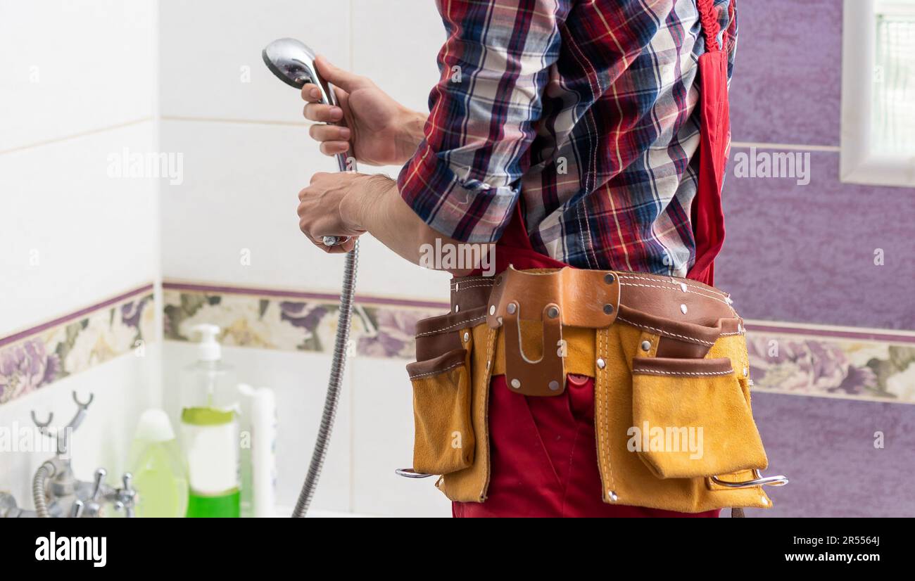 Plumber installing a shower cabin in bathroom Stock Photo Alamy