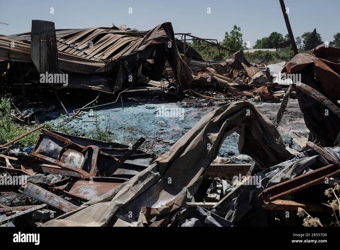 Galilee, Israel. 31st May, 2023. Distorted steel remains of a warehouse hit by a rocket launched from Lebanon at a northern Israeli village, unnamed for security reasons, on 6th April, 2023. The Israeli government stated the rockets were fired by Palestinian factions Hamas and the Palestinian Islamic Jihad with Hezbollah's approval. The attacks were the largest escalation between the two countries since the 2006 Lebanon War and were one of the factors leading to Israel's Operation Shield and Arrow in the Gaza Strip. Credit: Nir Alon/Alamy Live News Stock Photo