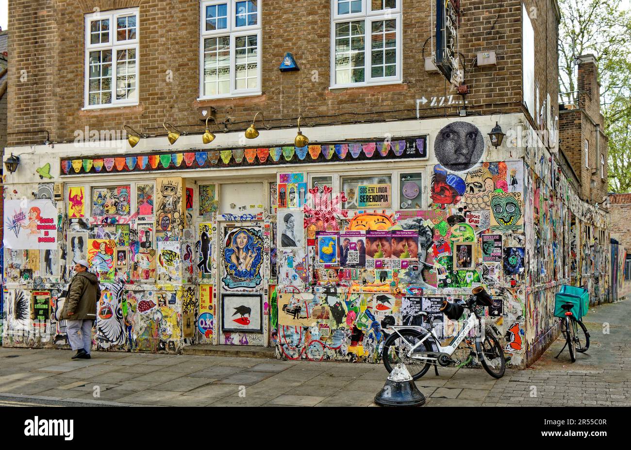 London Brick Lane Tower Hamlets shops cafes restaurants house wall with