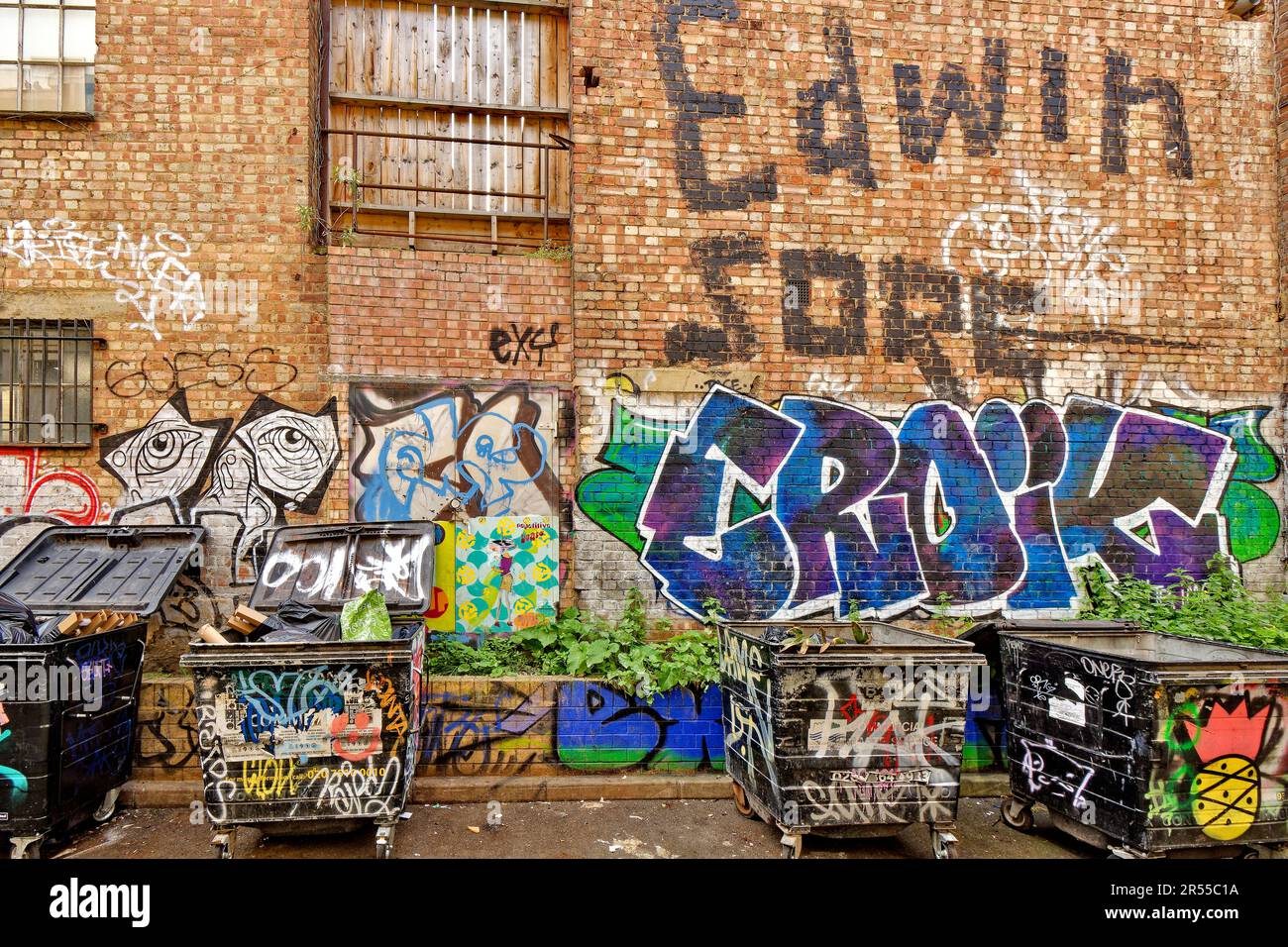 London Brick Lane Tower Hamlets shops cafes restaurants large wall and