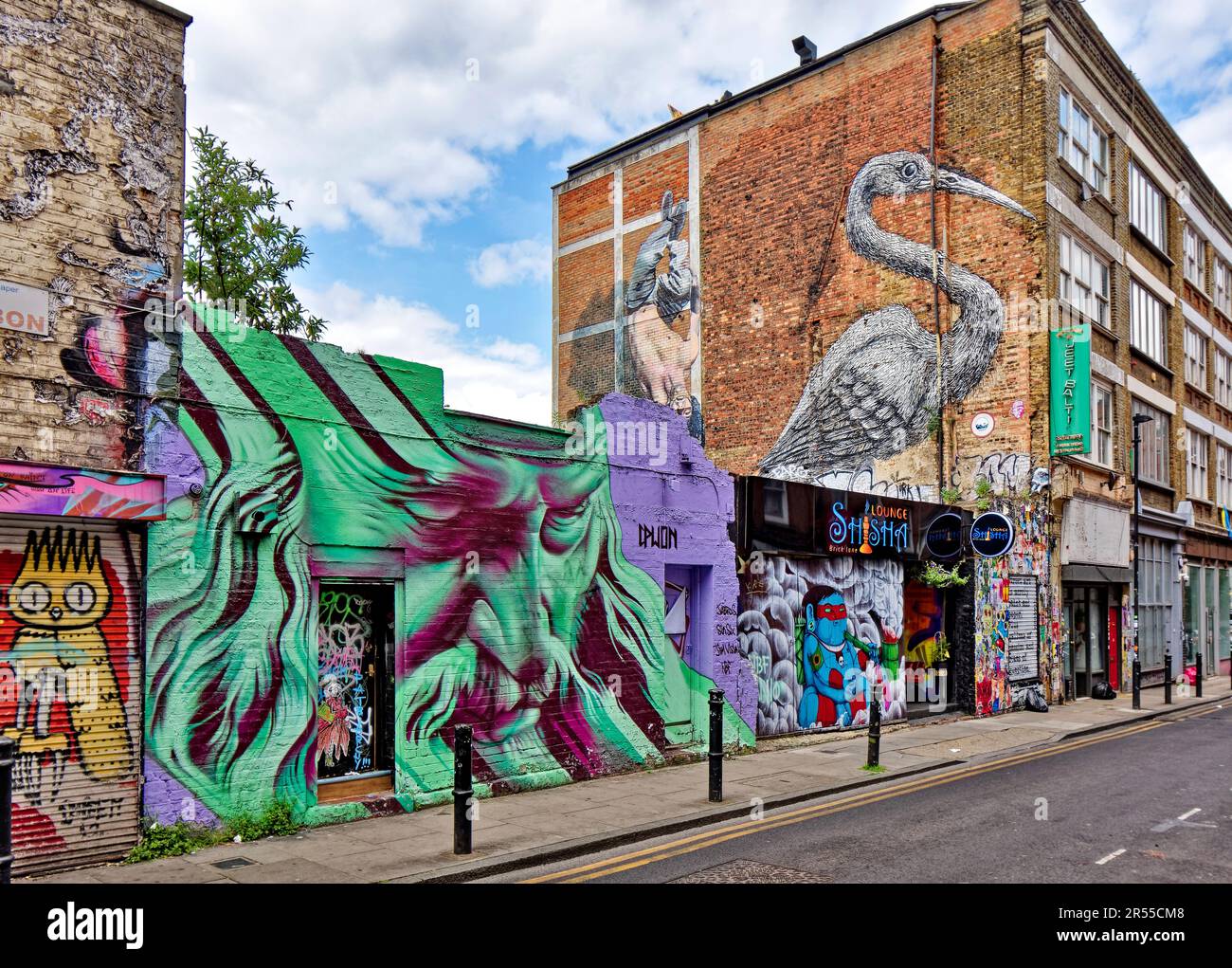 London Brick Lane Tower Hamlets shops cafes restaurants wall with