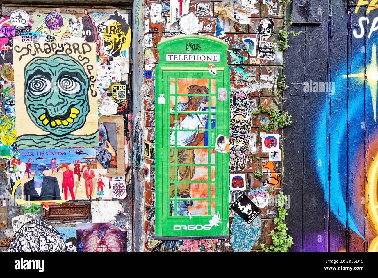 London Brick Lane Tower Hamlets shops cafes restaurants wall with original gaffiti Stock Photo