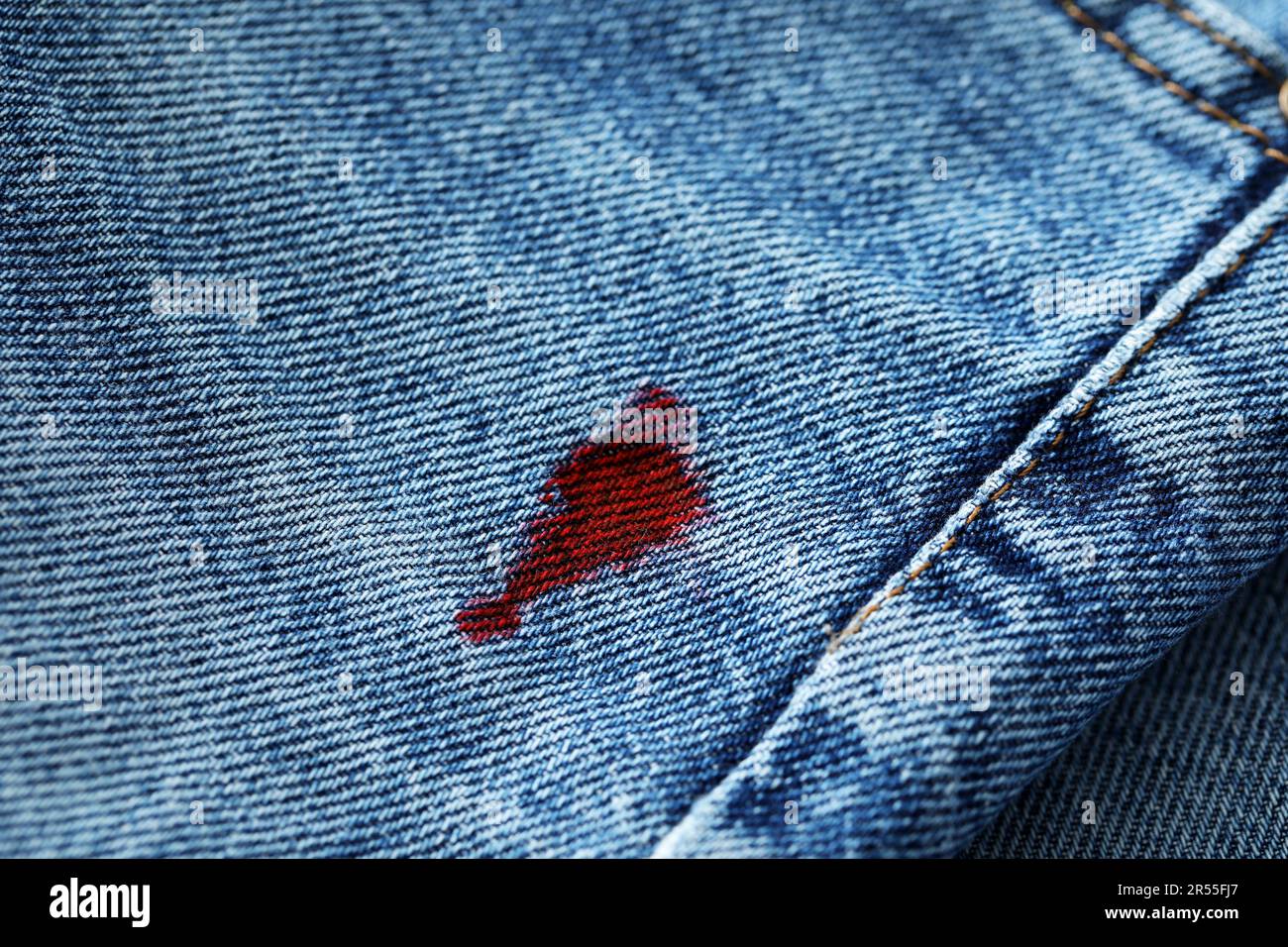 Stain of red ink on jeans, closeup Stock Photo - Alamy
