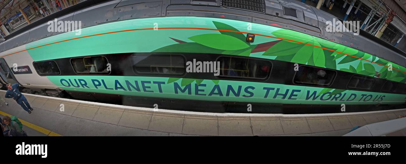 Green-liveried Avanti West Coast Class 390 Pendolino at Crewe railway station on the West Coast Main Line, displaying environmental messaging Stock Photo