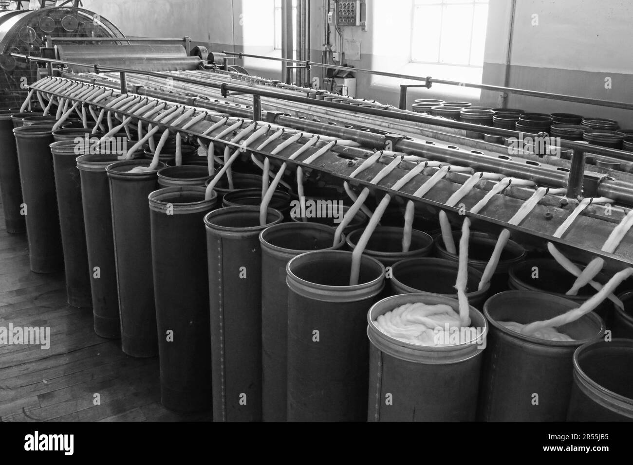 Drawing frames (sometimes called draw frames) with sliver cans, as used in Lancashire cotton spinning mills Stock Photo