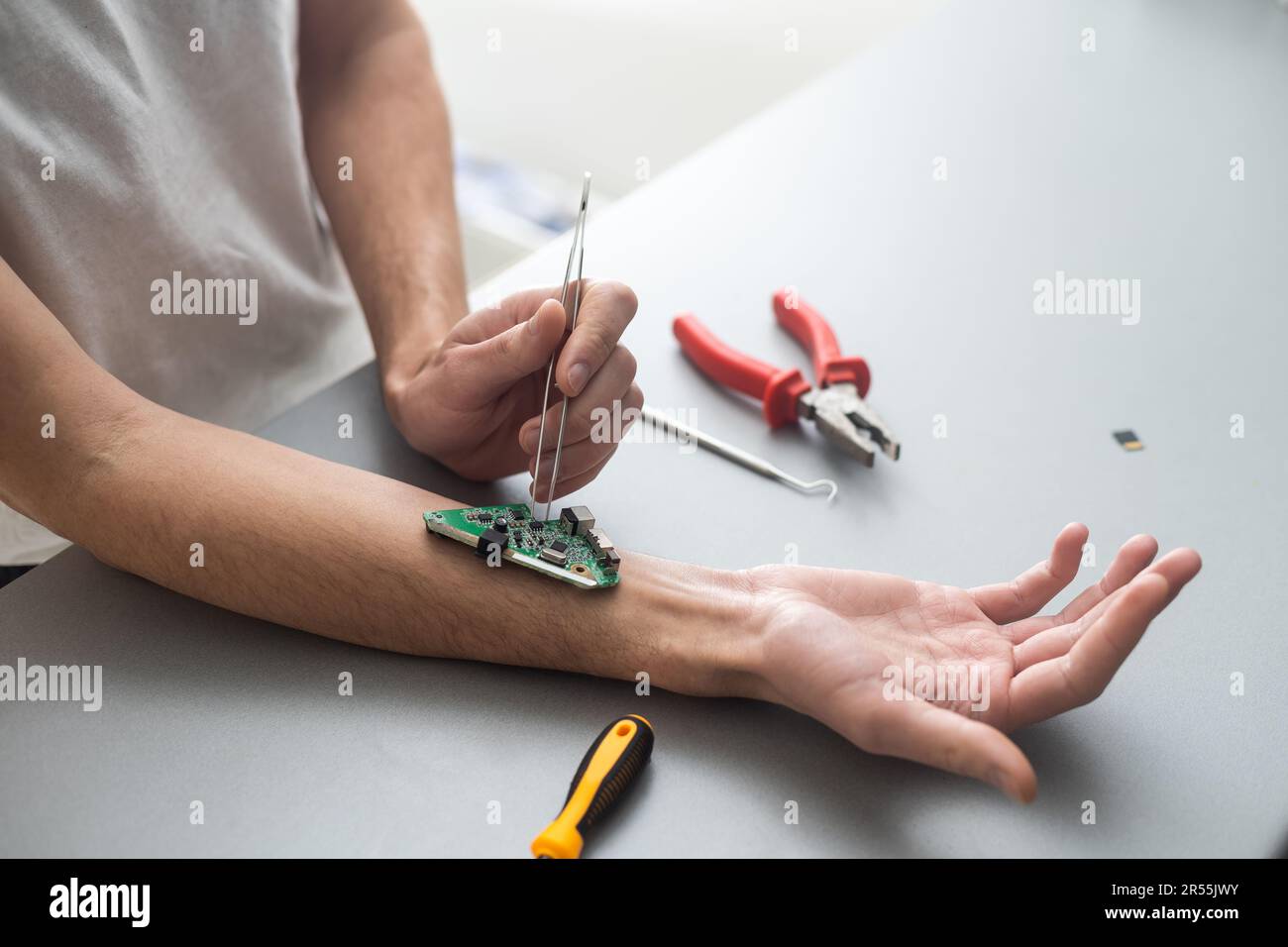 Hand with implantation of micro chip. X-Ray view close-up. Chipization of people, control population Stock Photo