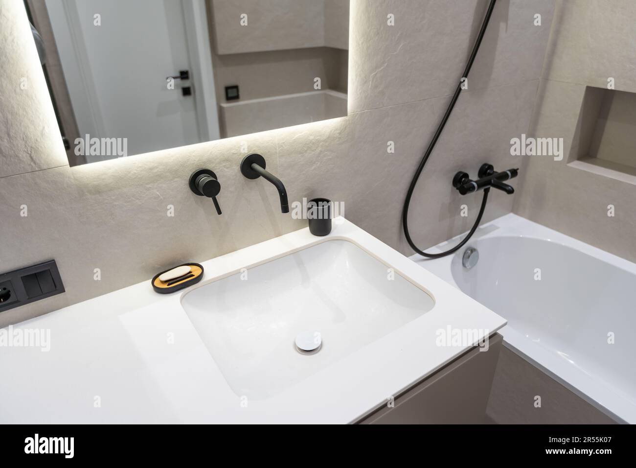 black fittings in the bathroom white background Stock Photo - Alamy