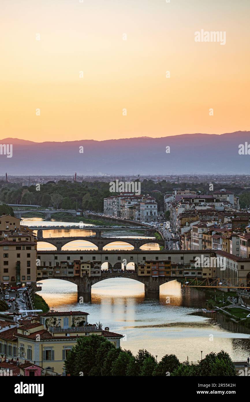Sunset At Florence With Ponte Vecchio Bridge At Arno River Stock Photo sunset-at-florence-with-ponte-vecchio-bridge-at-arno-river-stock-photo