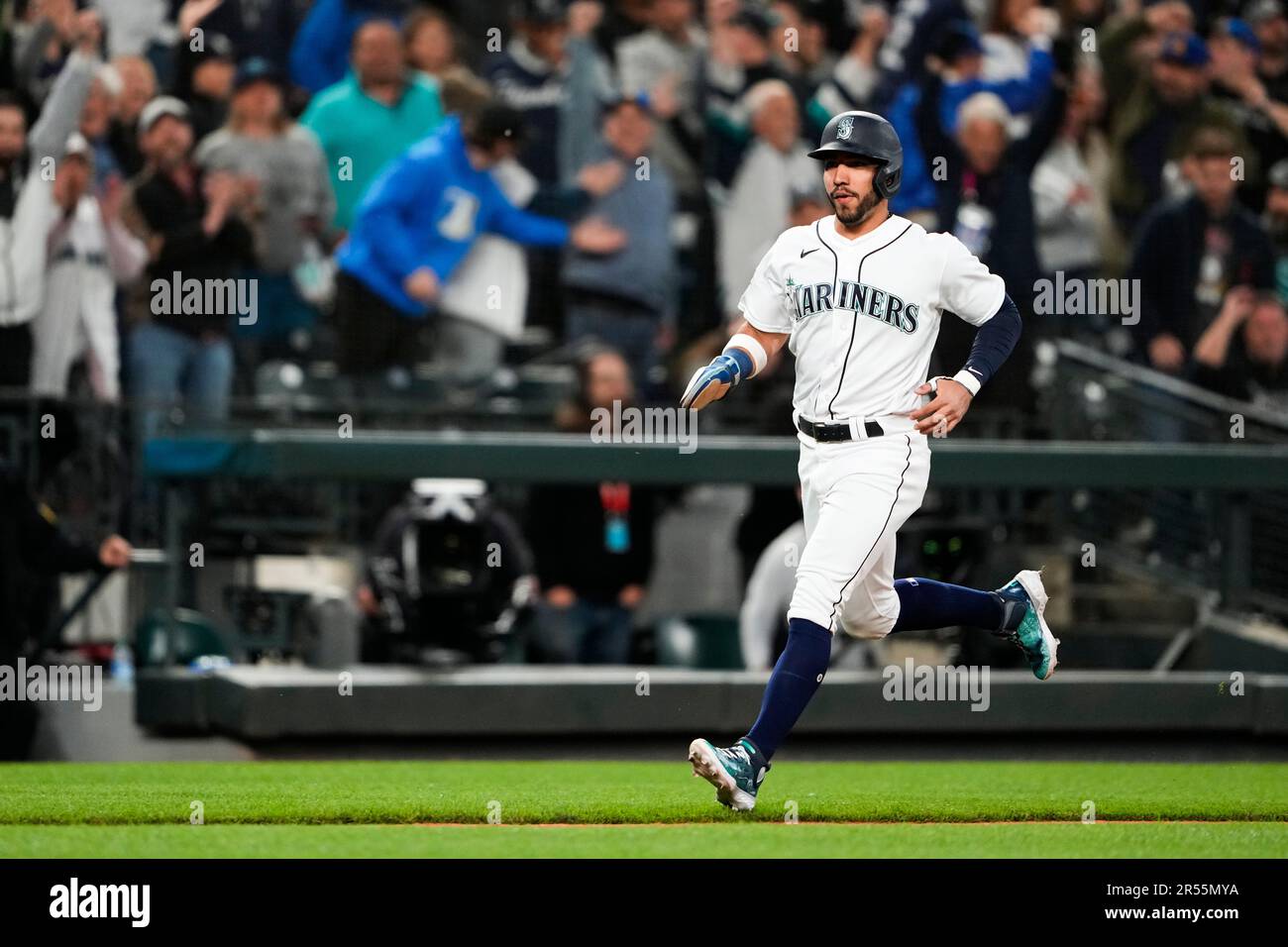 Seattle Mariners' Jose Caballero runs home to score on a walk-off single  from Cal Raleigh to win the game 1-0 against the New York Yankees during  the 10th inning of a baseball