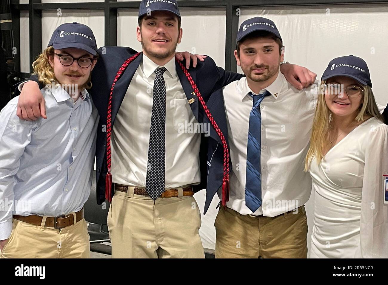Students, from left, James Holt, Will Gower, Nicholas Colasacco, and  Savannah Gibson, all 21, pose for a photo in Hagerstown, Maryland on  Tuesday, April 25, at graduation from the Pittsburgh Institute of