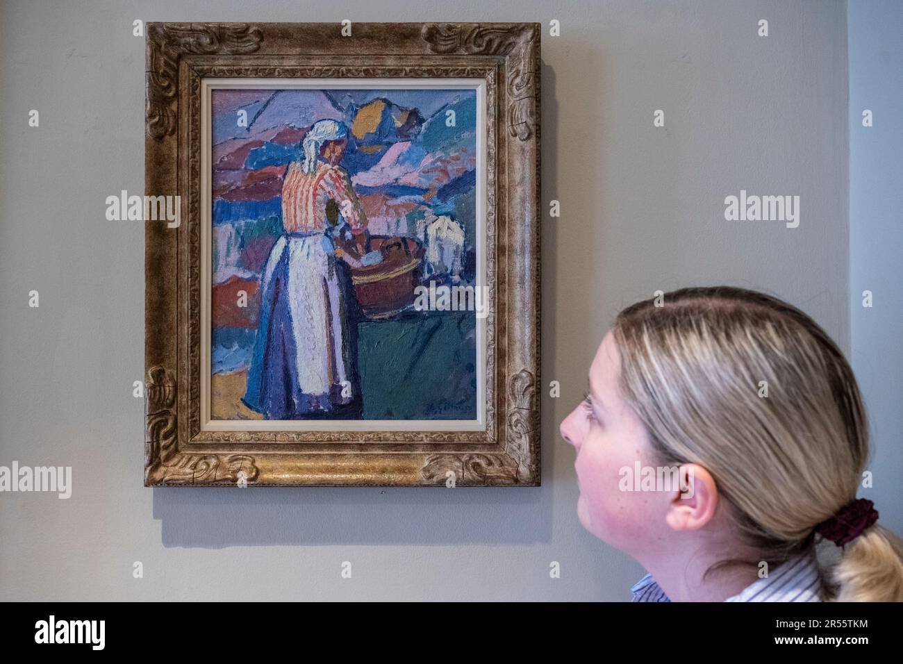 London, UK. 1 June 2023. A staff member views ‘The Washerwoman (La