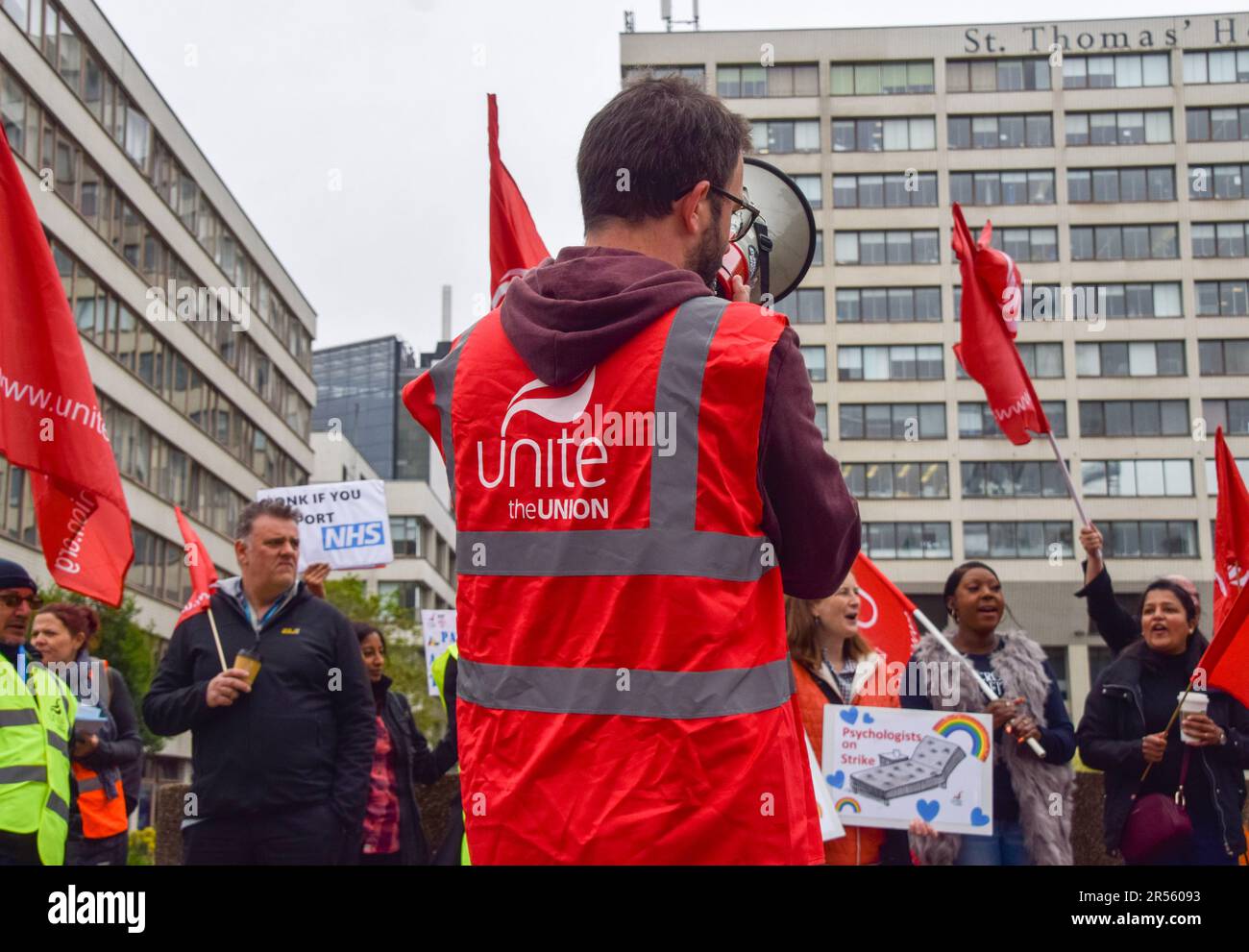 A Unite union member chants slogans through a megaphone at the picket