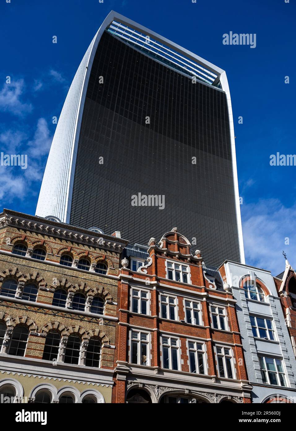 London, UK: The Walkie-Talkie or Fenchurch Building at 20 Fenchurch Street towers over the older buildings below. Buildings of Eastcheap in foreground Stock Photo