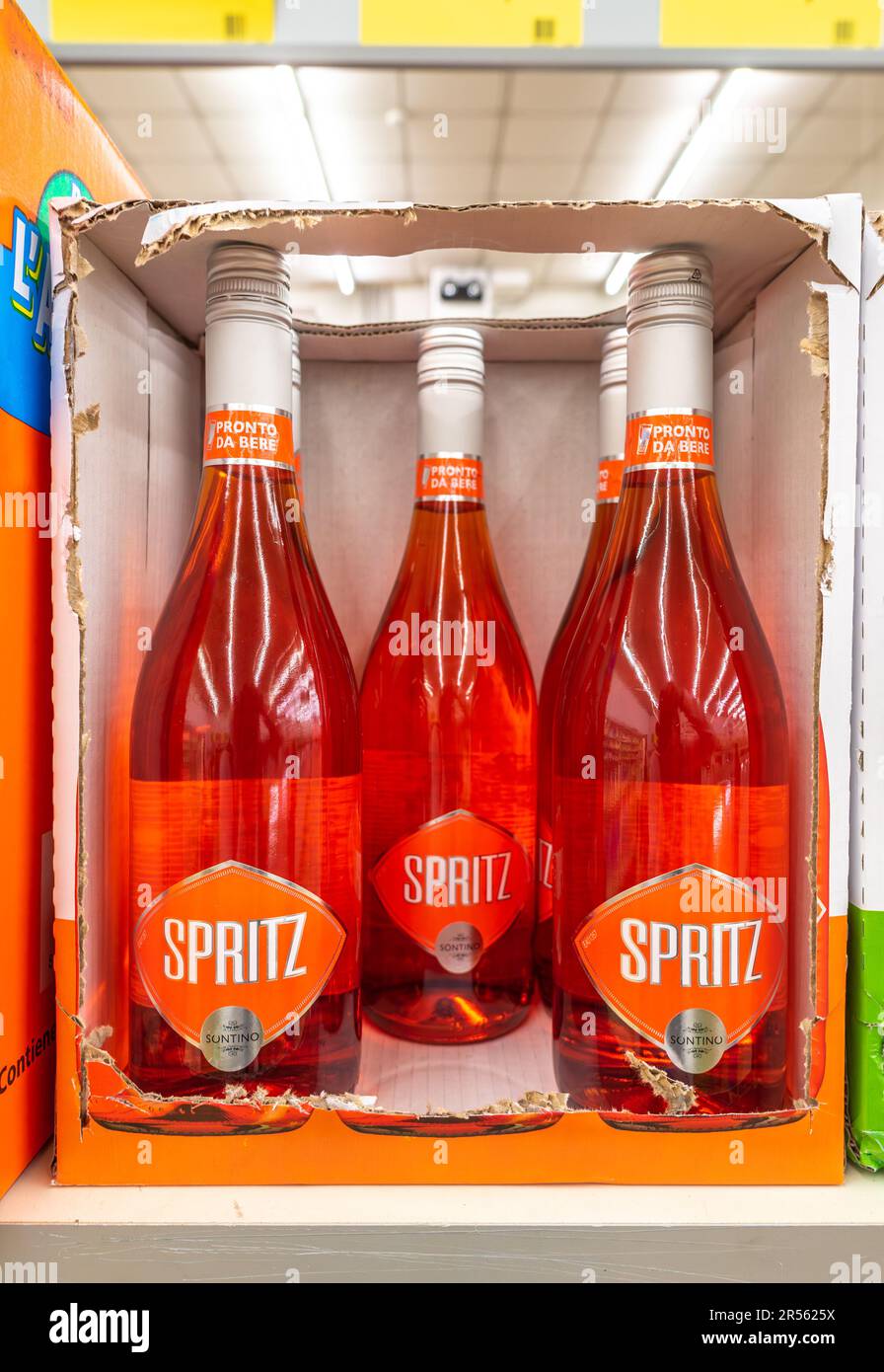 Italy - May 21, 2023: Bottles of ready-to-drink Spritz cocktails displayed in cardboard boxes for sale on Italian discount store shelf at affordable p Stock Photo