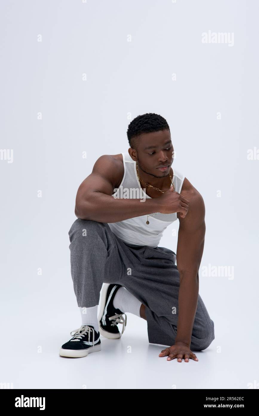 Full length of muscular young african american man in tank top and ...