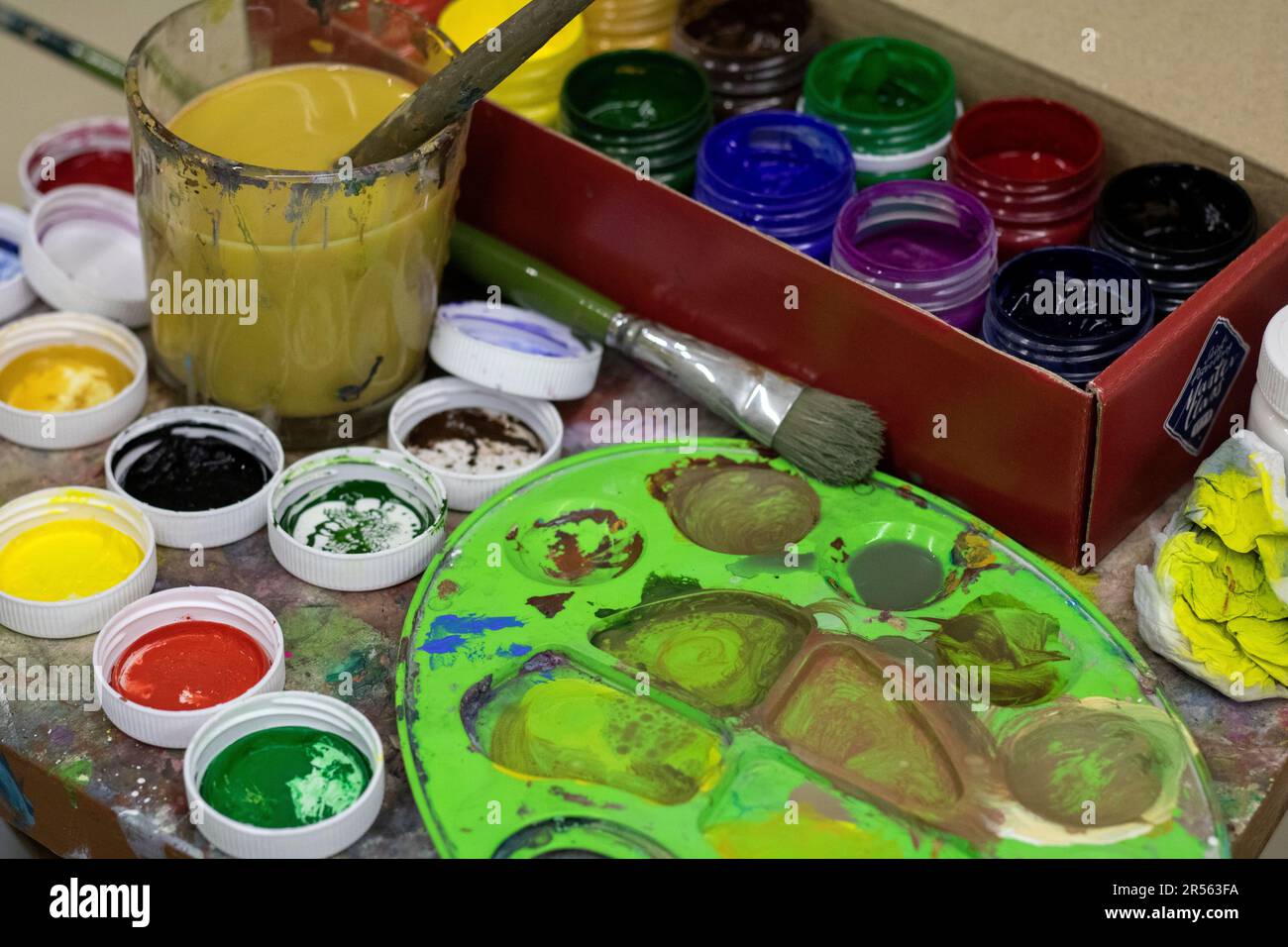 photo of opened of paint cans and brushes Stock Photo Alamy