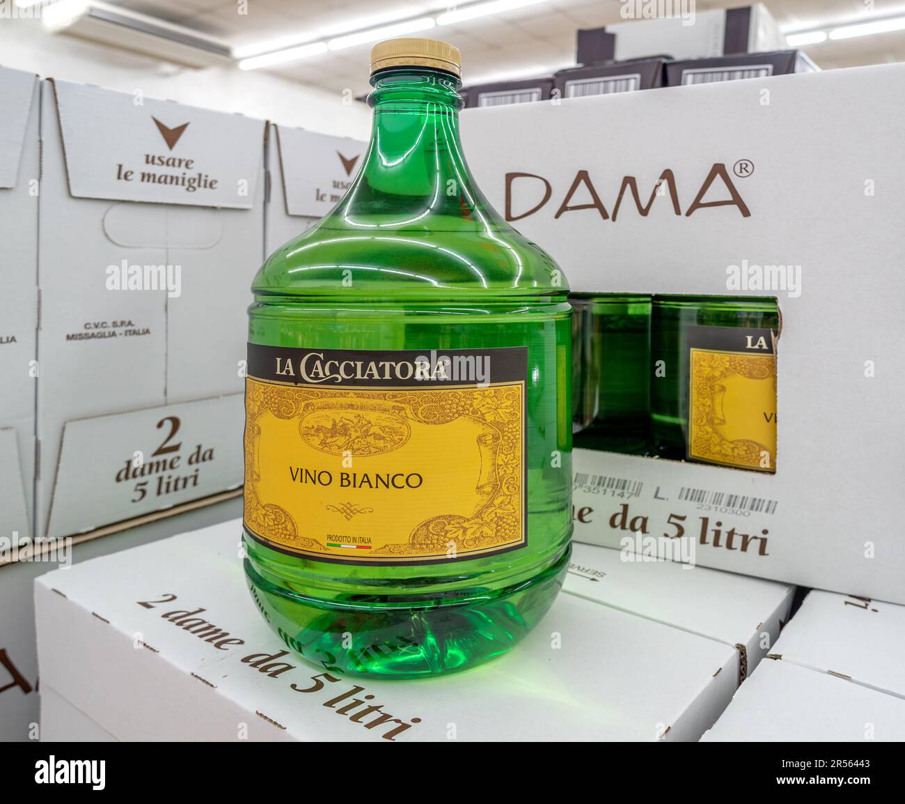Italy - May 21, 2023: Italian white wine in 5-liter bottle, called in Italian Dama, displayed on cardboard boxes of La Cacciatora brand for sale in It Stock Photo