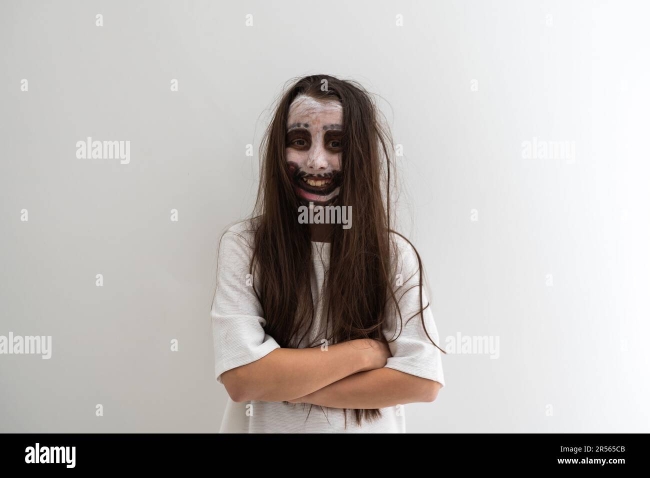 scary girl in white dress from horror film in room Stock Photo - Alamy