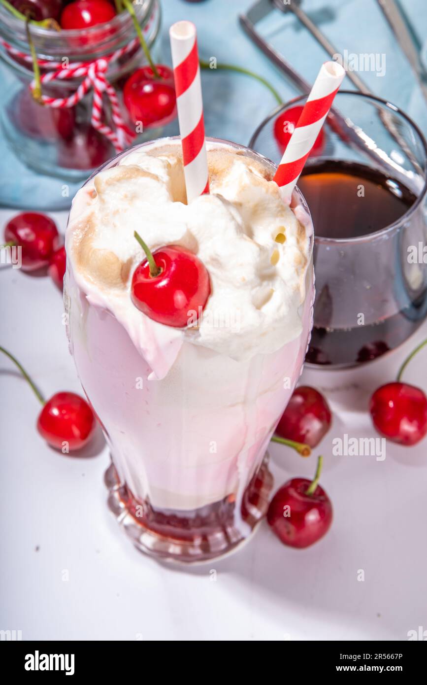 Sweet homemade cherry-cola milkshake with whipped cream, ice cream ...