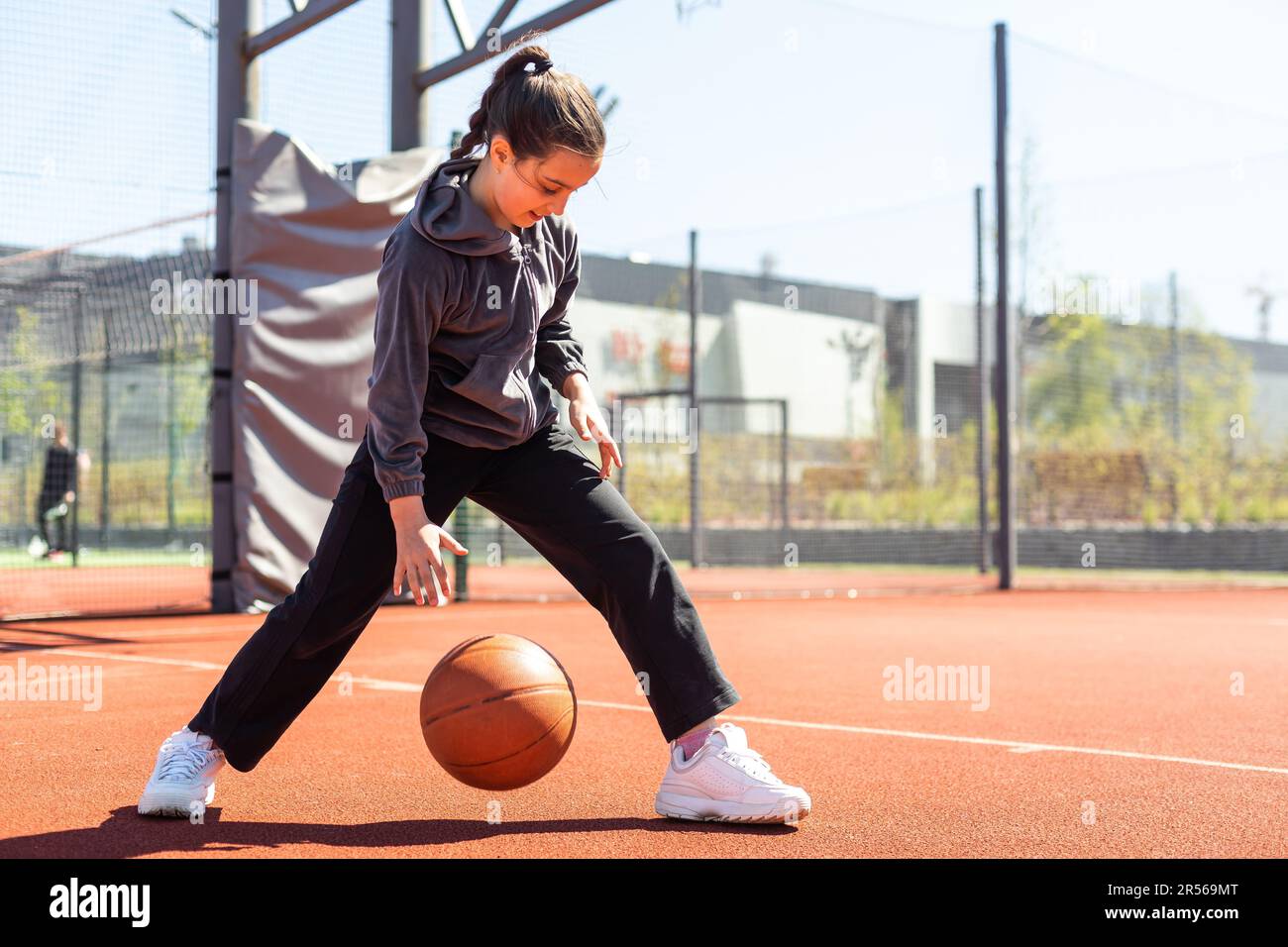 beautiful girl shooting basket and playing basketball Stock Photo Alamy