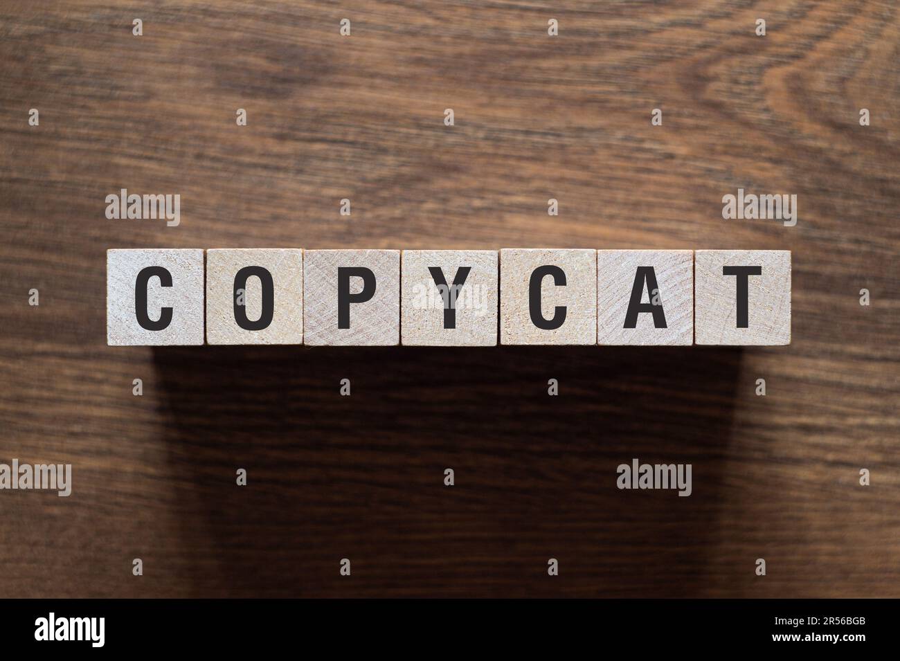 Copycat word concept on building blocks, text, letters Stock Photo