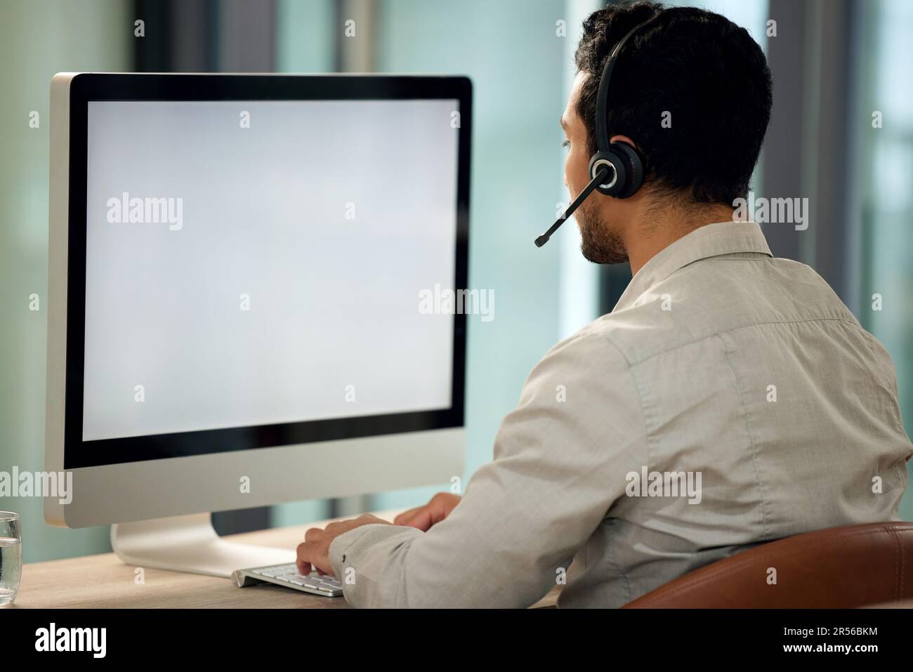 Call center, man and back with computer, typing and blank screen for ...