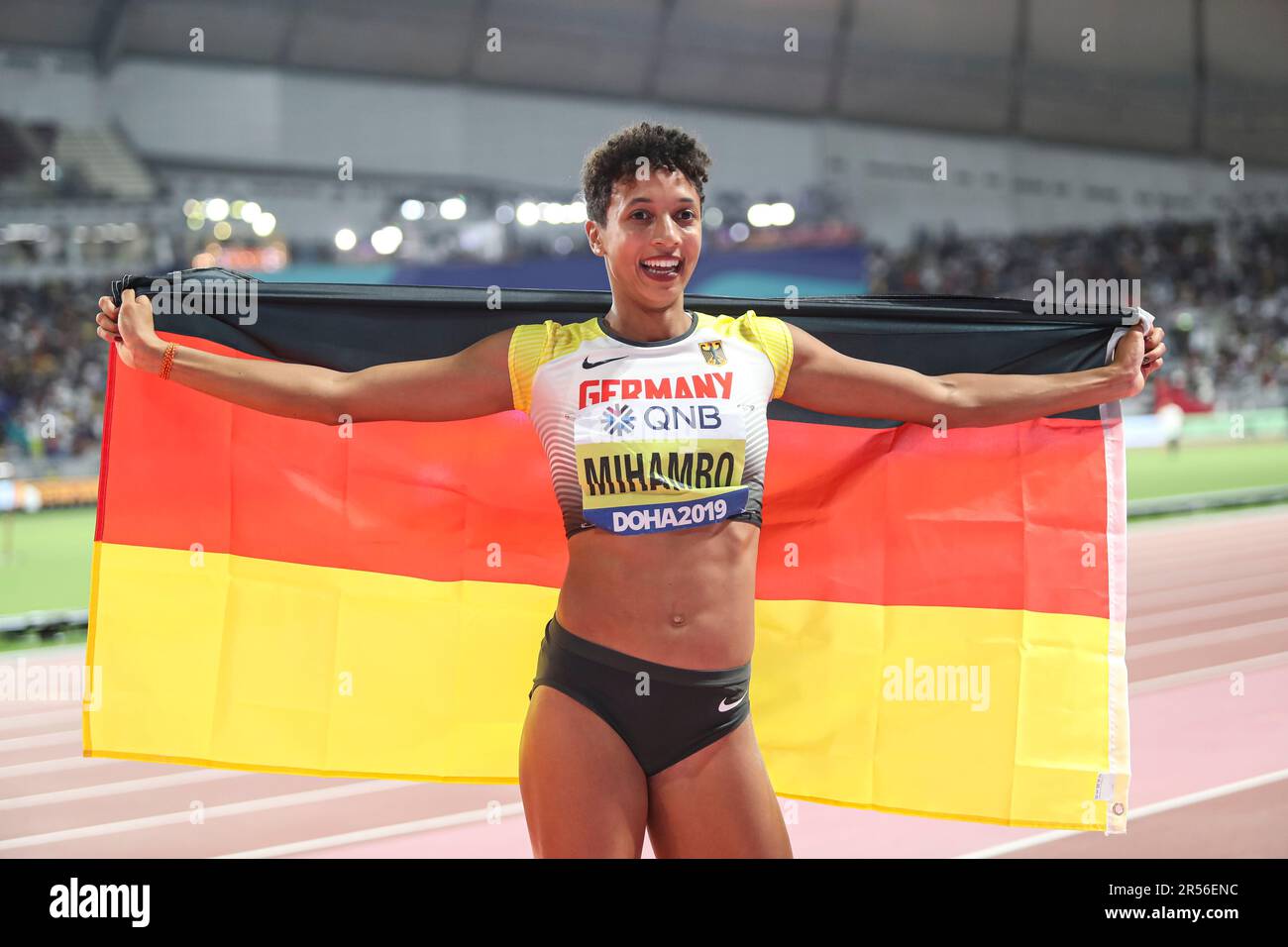 Malaika MIHAMBO celebrating with her country's flag in the long jump at