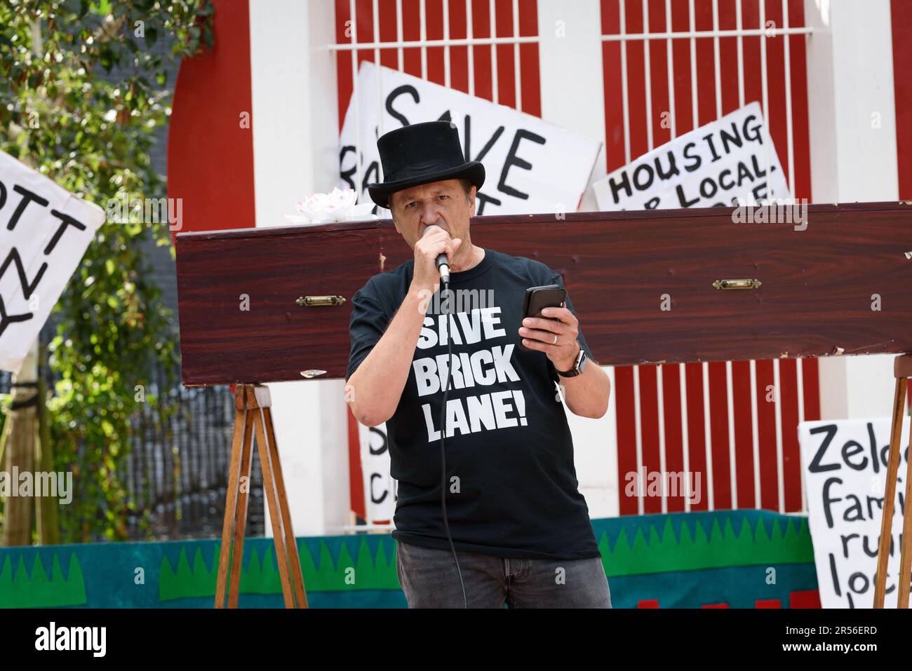 A community activist addresses a rally in Altab Ali Park against plans to build shops and offices on the Truman Brewery site in Brick Lane, London. Stock Photo