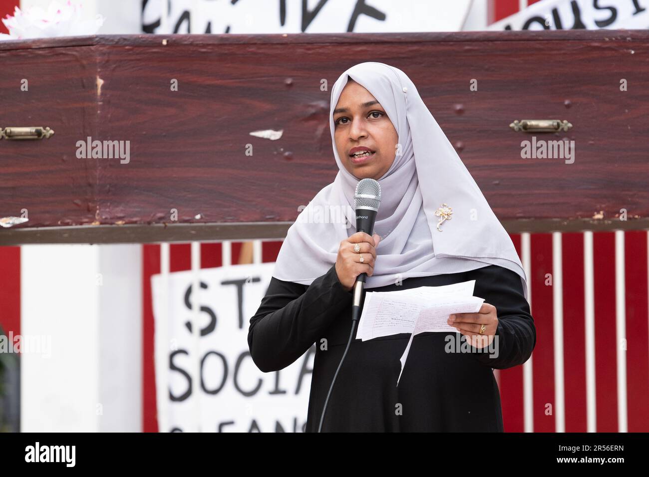 A community activist addresses a rally in Altab Ali Park against plans to build shops and offices on the Truman Brewery site in Brick Lane, London. Stock Photo