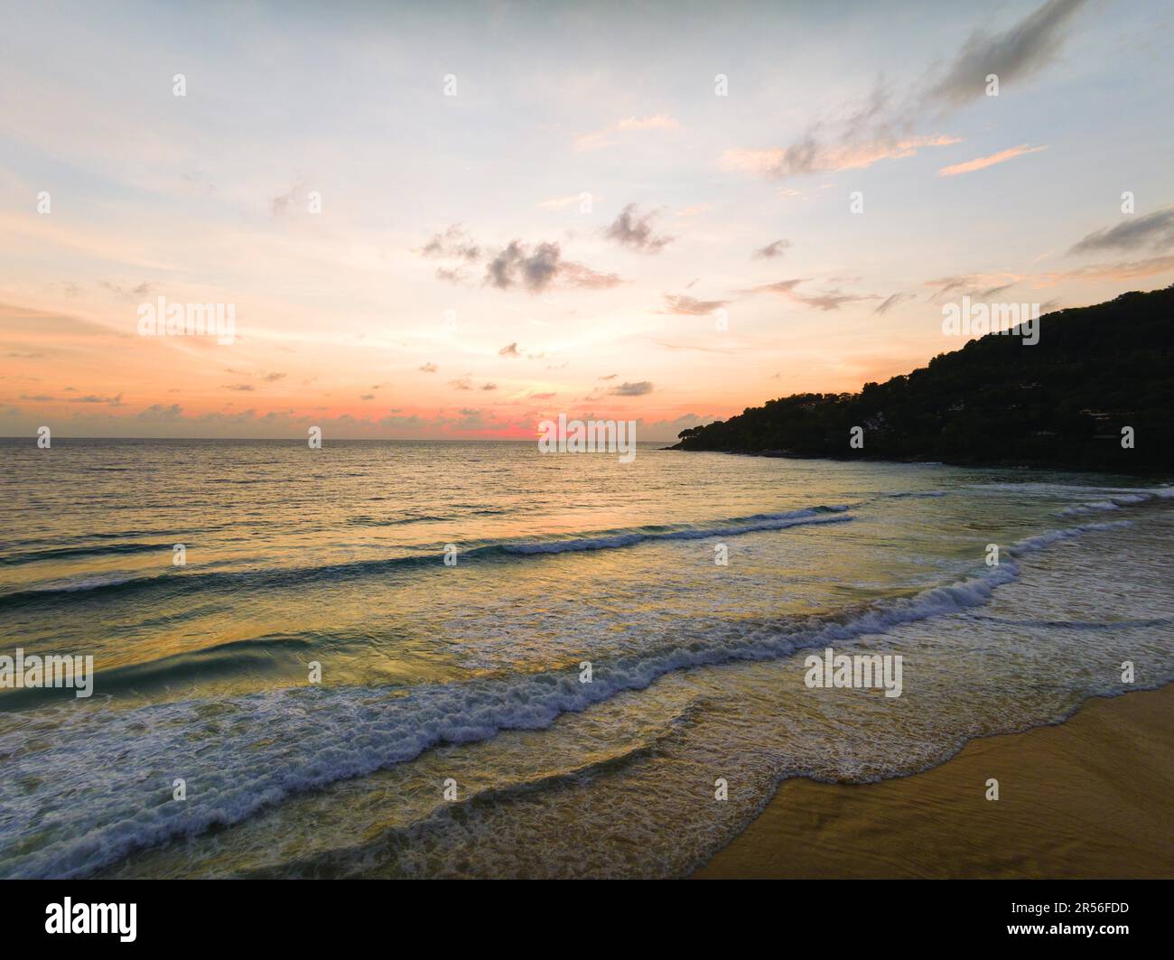 Waves on beach in sunset hi-res stock photography and images - Alamy