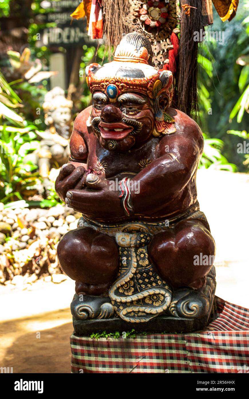 Balinese God statue in temple complex Taman Beji Griya Waterfall