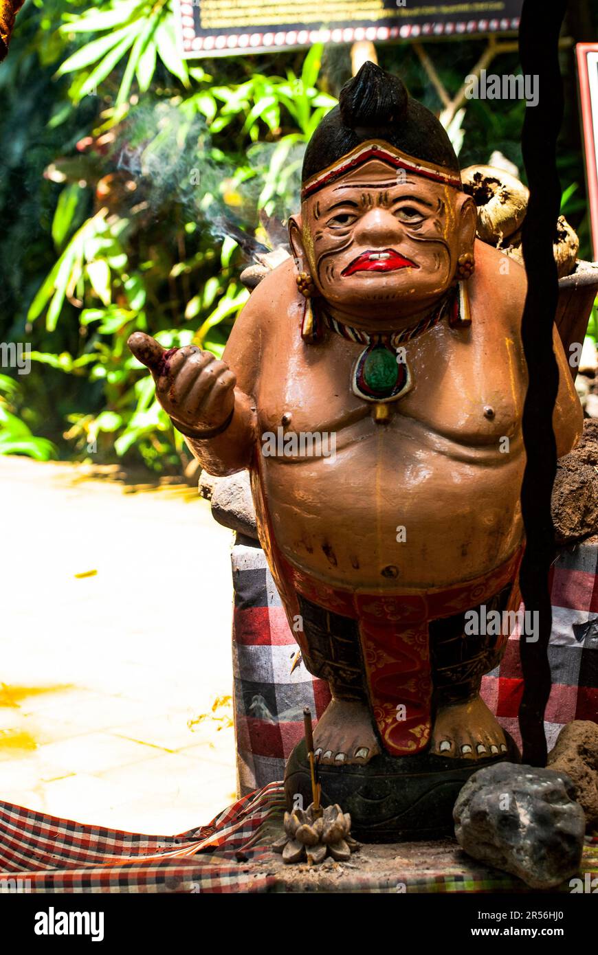 Balinese God statue in temple complex Taman Beji Griya Waterfall