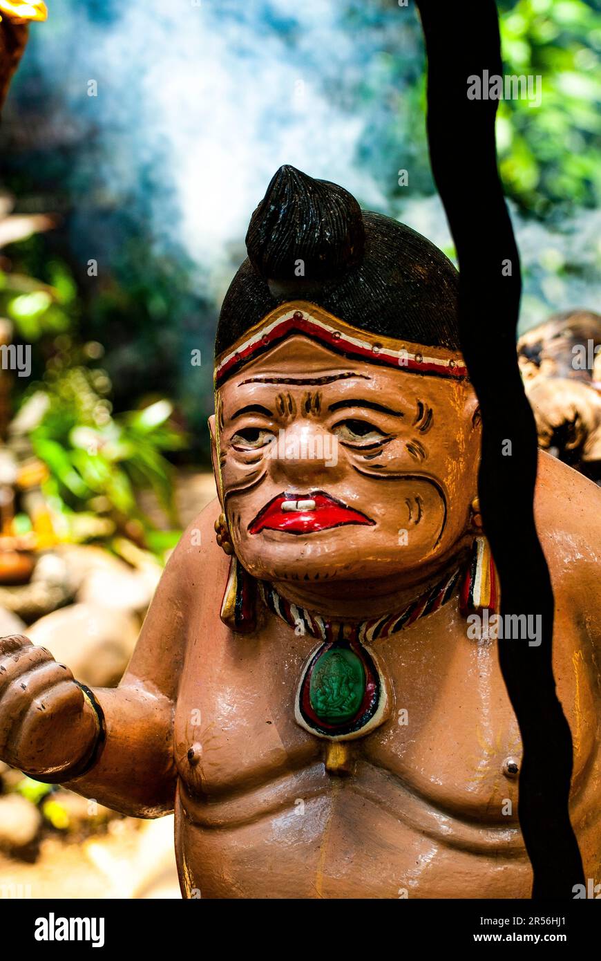 Balinese God statue in temple complex Taman Beji Griya Waterfall