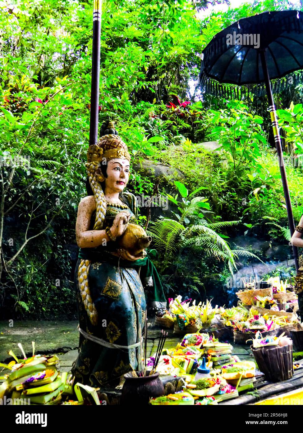 Balinese God statue in temple complex Taman Beji Griya Waterfall