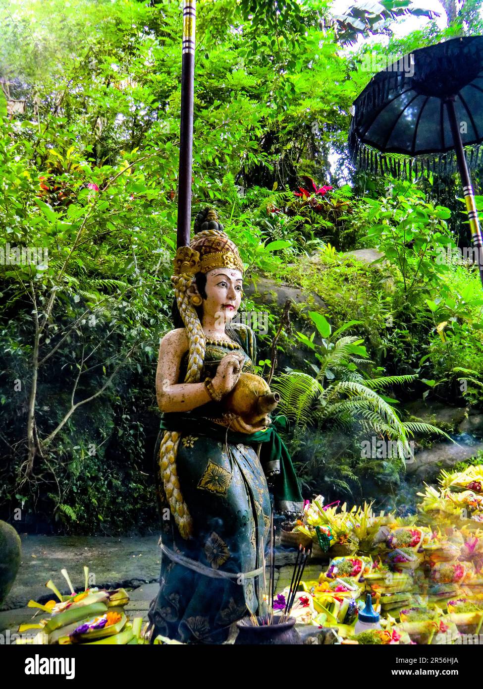 Balinese God statue in temple complex Taman Beji Griya Waterfall