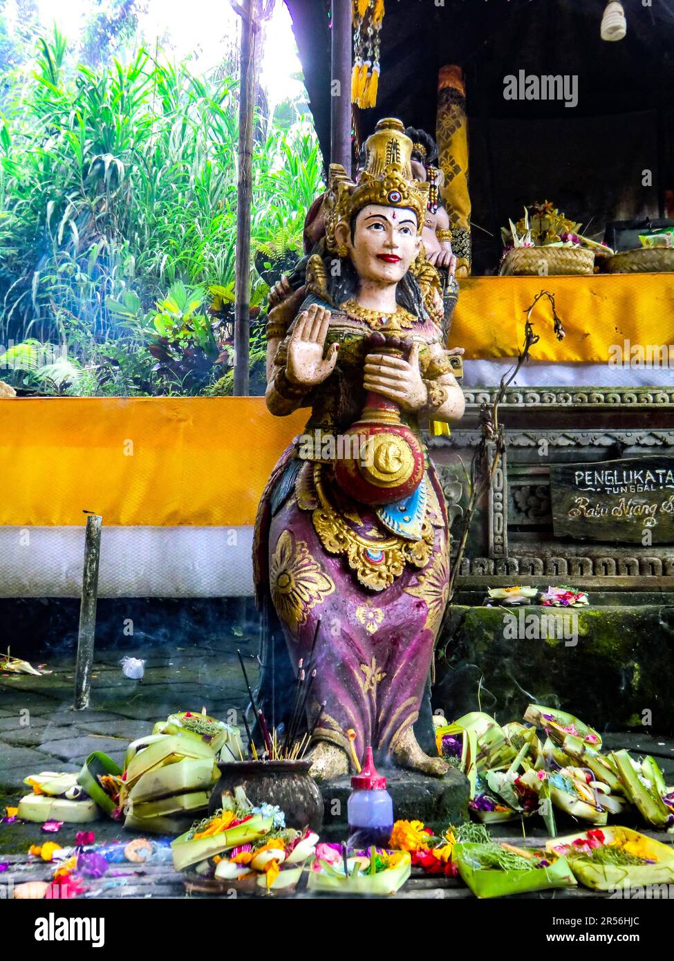 Balinese God statue in temple complex Taman Beji Griya Waterfall