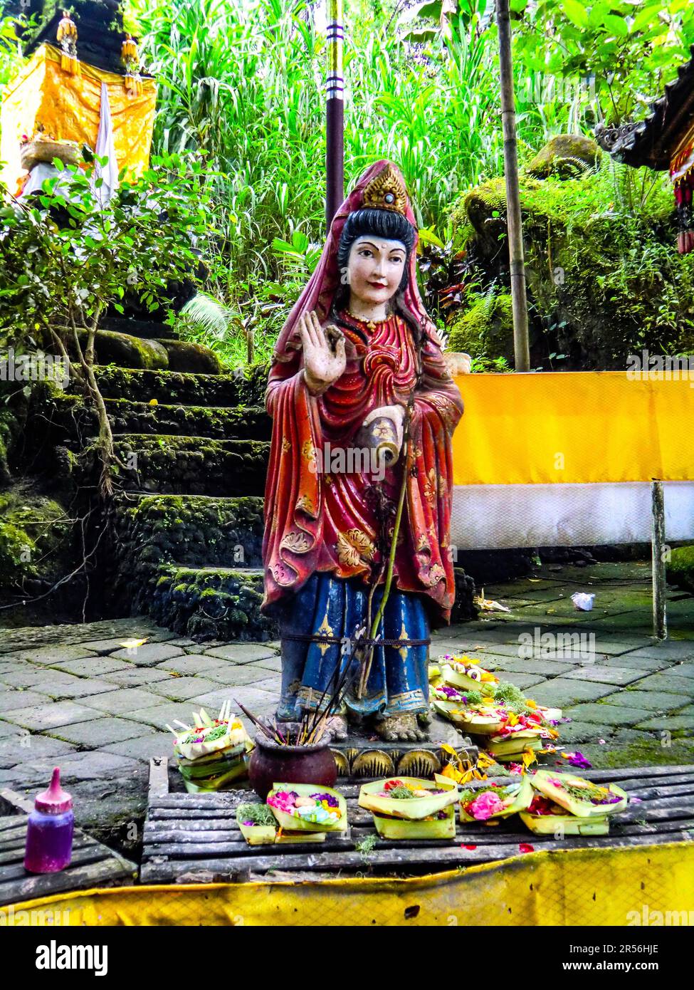Balinese God statue in temple complex Taman Beji Griya Waterfall
