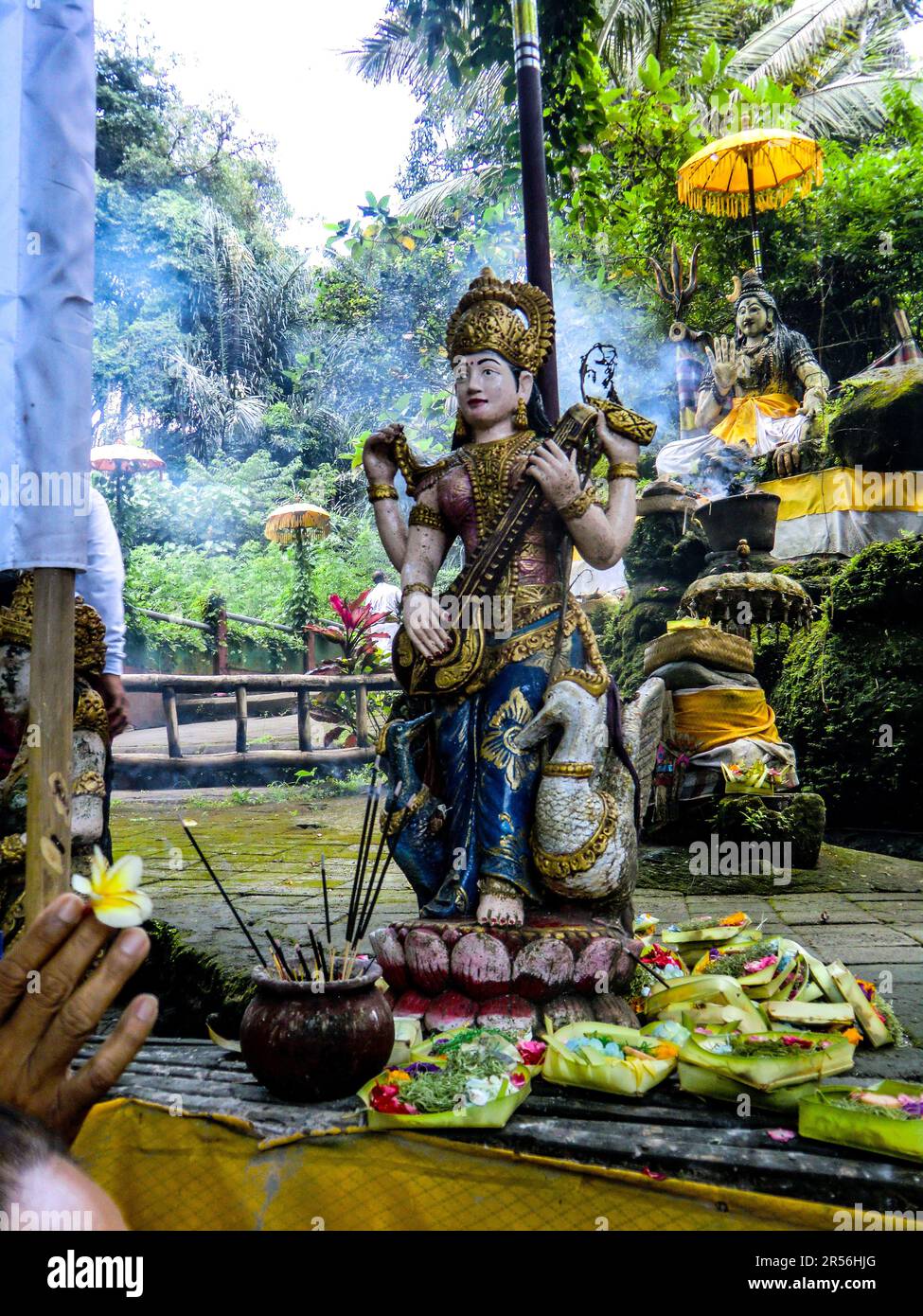 Balinese God statue in temple complex Taman Beji Griya Waterfall